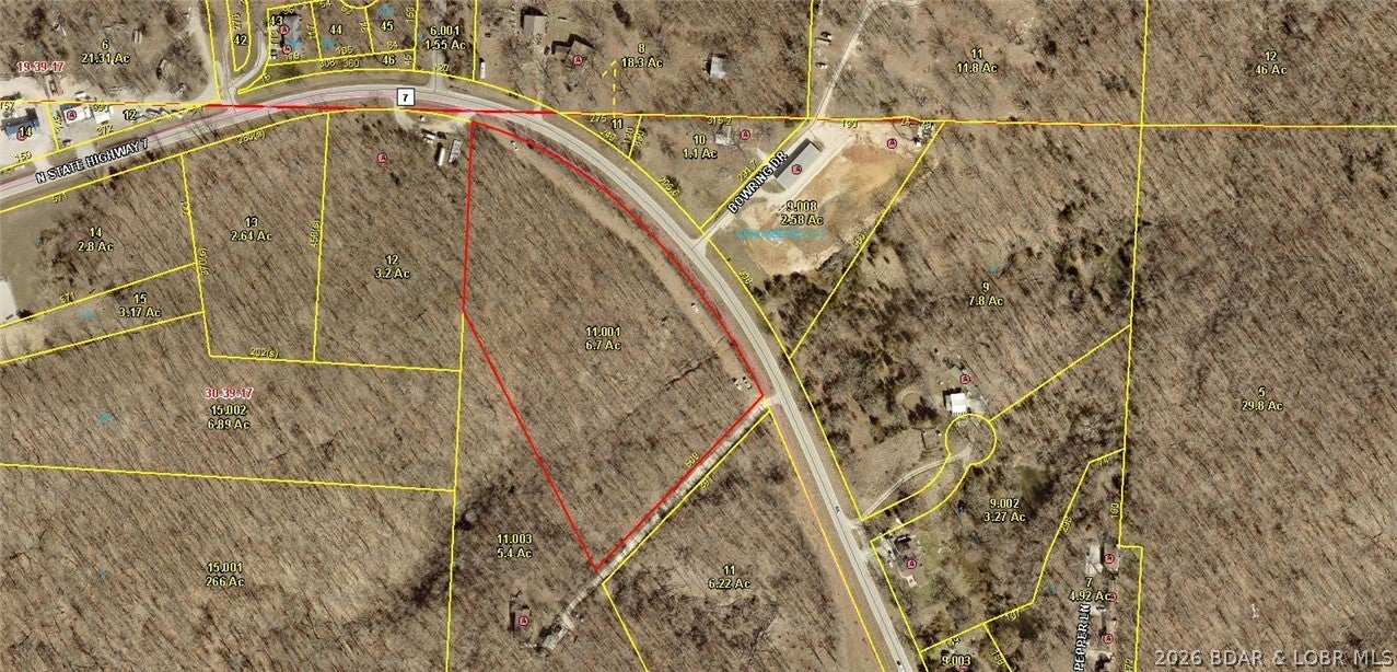 This Great Location 6.65 acre tract of land is conveniently located about a mile north from the Hwy 5 and N. Hwy 7 intersection! This would be a great property to build a private residence or business or just sit and keep for as a future investment! It has 805 ft of premium Highway 7 frontage on the stretch from Camdenton towards Greenview and is close to the lake, fishing, golf, restaurants & bars, and all the great entertainment the area has to offer! There are Electrical Poles that run through the front of the property so easy access to hook up! Don't miss out on this great opportunity to build your dream home or business! Come Check it out!