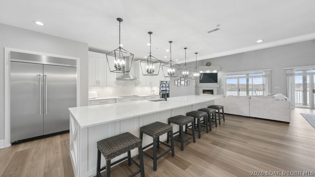 This doesn't come around often. Owner Financing Available. This one-of-a-kind Stoneledge Condominium is the only one with this exclusive floorplan that you do not want to miss out on. Featuring 4 spacious bedroom suites and 2 versatile loft areas, there's room for everyone to spread out and enjoy. Three suites are on the walk-in main level, while the upper-level suite boasts its own private living space—perfect for guests. And the best part? No steps to get inside! With elevator service from the parking level to the pool level, convenience is built right in. The full-length, tiled covered deck offers breathtaking main channel views—an ideal spot for dinners, drinks, and unforgettable sunsets. Love the lake life? You’ll fall for the stunning views right from your covered balcony and oversized 16x48 boat slip—plenty of room for your dream boat and then some. Quality is UNMATCHED at Stoneledge, known for its superior construction and peaceful, upscale environment with no short-term rentals (under 6 months) allowed. Location, views, space, and style—this is lakefront living at its finest!