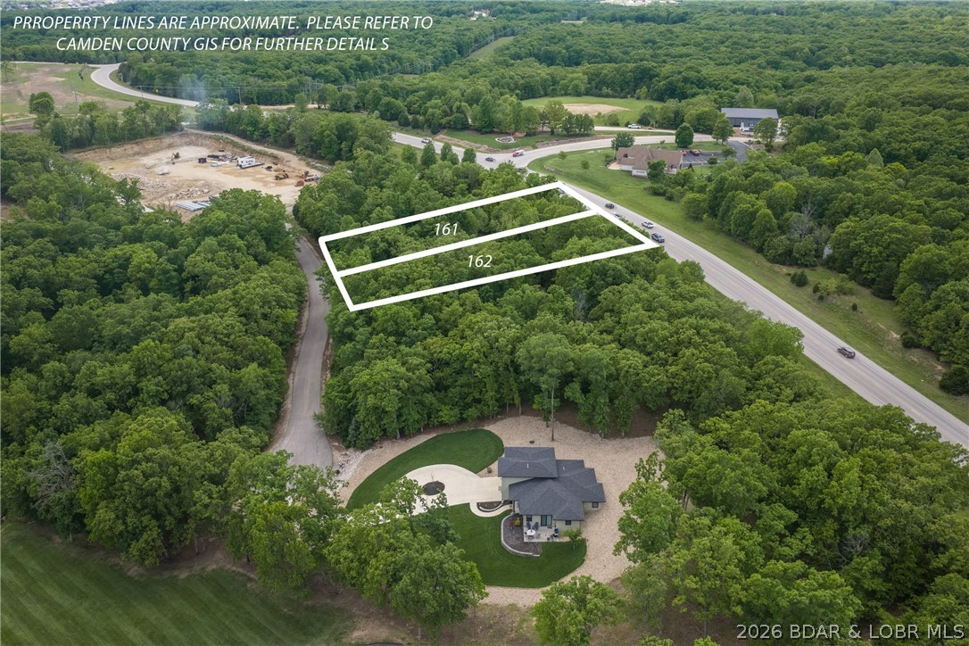 Affordable building lot in Porto Cima. Your chance to have a homesite in one of the nicest golf course subdivisions in the Midwest. Porto Cima is truly the finest golf and boat community in the Midwest. It is a short distance to both the marina and clubhouse. Buy your lot today and start planning your home of tomorrow. Gentle lot with great access and topography. Different types of memberships available. This lot is a great value, come start your home today. If you like this lot the one directly next door is available also. Start both homes at the same time to save cost and increase efficiency.