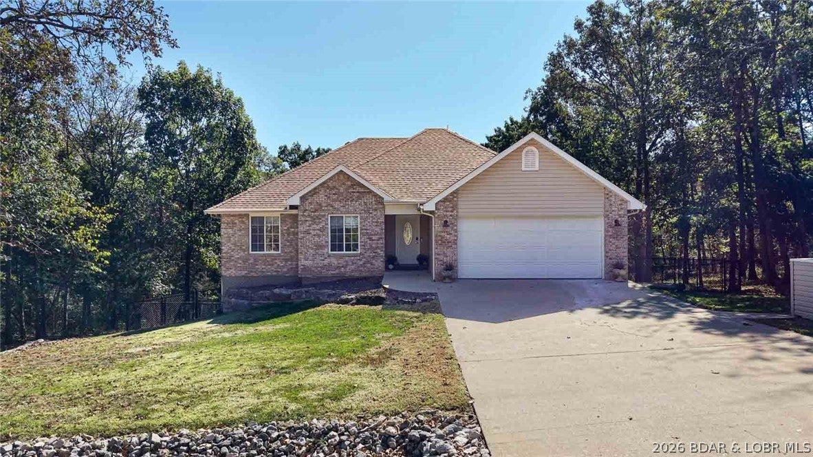 Beautiful home situated on three lots, including two wooded lots for added privacy. The level driveway and entrance allow for convenient main-level living if desired with a full basement for plenty of extra living space. Features include an updated kitchen with new countertops and backsplash, fenced backyard, and deck overlooking the wooded setting. Four Seasons amenities include indoor and outdoor pools, boat ramps, fitness center, tennis courts, dog park, playgrounds, and clubhouse, walking path, and more. This is one you will want to see for yourself!