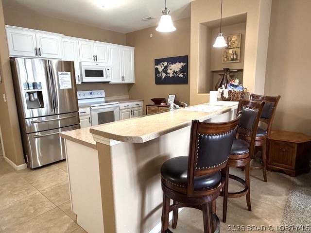 Experience lake living at its finest and even increase the bank account. This unit has proven to be an excellent income producing investment. Or simply reserve it for quality time with family & friends. Imagine waking up to a breathtaking, panoramic lake view from the bedside of this beautifully furnished 3-bedroom, 2-bath lakeside condo. Perfect as a full-time residence, weekend retreat, or investment property, this move-in-ready getaway offers comfort, convenience, and resort-style amenities. You'll relax on the spacious covered deck taking in the cool lake breeze while you capture the view of boats below. Or maybe you prefer to cozy up inside by the fireplace after a day on the lake. The open floor plan is designed for easy entertaining, just open the slider and take the party outdoors to watch the sunset. It's a perfect full-time residence, weekend retreat, or investment property, this move-in-ready getaway offers comfort, convenience, and resort-style amenities.  The seller is offering it fully furnished, including the boat slip— so just grab a fishing pole and your swimsuit!
