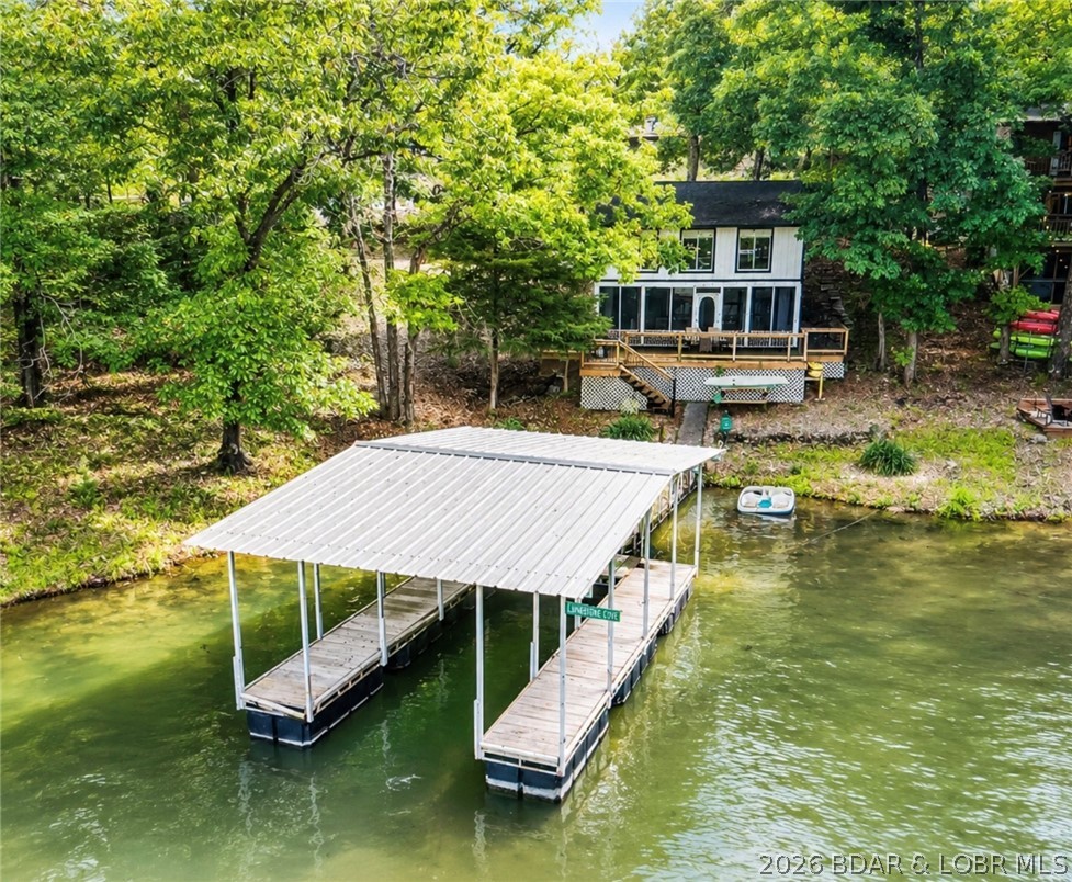 If you have been searching for an affordable lakefront getaway with breathtaking views, easy water access, and short term rental potential, this is the one. This 3-bedroom, 2-bath lakefront home offers the perfect mix of relaxation, investment opportunity, and true Lake of the Ozarks living.

Enjoy stunning lake views and a peaceful waterfront setting with a gentle lot leading to your private dock, making lake days effortless whether you are boating, fishing, swimming, or simply relaxing by the water. The outdoor space is perfect for entertaining, enjoying sunsets, and making unforgettable memories at the lake.

One of the biggest advantages of this property is NO HOA, giving you the freedom to enjoy the property your way while also allowing short term rentals, making this a great opportunity for investors or anyone looking to offset ownership costs with rental income.

Located in a fantastic area by both land and water, you are only a short drive to the Bagnell Dam Strip while still being close to popular lakefront destinations like LakeHouse 13, Paradise, and other local favorites by boat or car.