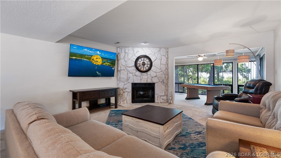 26 W Casa Del Rio Dr #2B in Lake Ozark offers true walk-in convenience with no steps and easy one-level living. With approximately 1,785 square feet plus a 210-square-foot enclosed porch, this 3-bedroom, 2-bath condo provides plenty of room to relax, entertain, or host guests. Enjoy an inviting living room with an electric fireplace, a well-equipped kitchen, generous bedrooms, and a walk-in primary closet. Many furnishings, appliances, washer and dryer, bar stools, pool table, and additional items are included per the inventory list. Residents also enjoy access to Four Seasons amenities, along with community pools and a playground. Association coverage includes cable, internet, water, sewer, trash, and yard maintenance. Rentals are allowed, including nightly, weekly, monthly, and longer-term options.