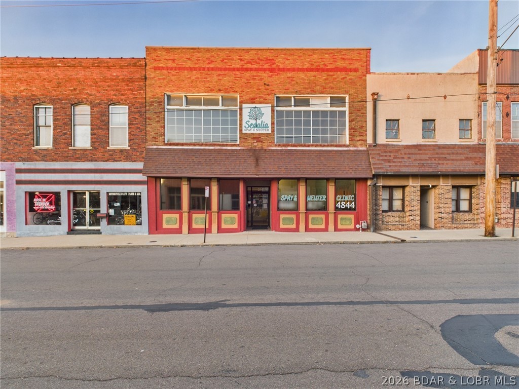 Located in Sedalia, Mo;  This well-preserved commercial building offers approximately 3,900 total square feet and is located in a historic district. The building is for sale with option of purchasing business separately. The building is currently occupied and operating as a turnkey veterinary practice with appointments approximatley booked for 2-3 weeks out. The clinic has an excellent reputation and has served cliental for approximately 10+ years in this building. The building has operated previously as a retail store, office supply shop, bakery & more—making it highly versatile for a wide range of uses. The main level features a welcoming lobby, receptionist area, common space, and a large preparation/processing area. An attached 35' x 26' garage provides excellent utility and includes two laundry hookups. The upper loft adds even more flexibility and is a blank canvas, ideal for a spacious studio, storage solutions, workshop, cubicle setup, or other customizable needs. With its adaptable layout and prime location, this property offers endless opportunities for the next owner or business.
