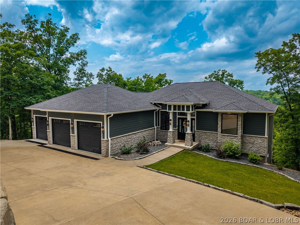 Prepare to be impressed by this stunning custom-built Thomas Construction home, where luxury craftsmanship and thoughtful design come together in one of Cross Creek's most desirable gated communities. Every detail showcases top-of-the-line finishes including heated bathroom floors, Andersen 400 Series windows, custom window treatments, and a striking floor-to-ceiling stone gas fireplace. The open-concept design captures incredible lake views and flows effortlessly to expansive Trex decking with both covered and screened outdoor living spaces. The spacious lower level features a John Deere room w/concrete golf cart path access, perfect for a side-by-side, golf cart, mower, and lake toys, plus an oversized 3-car garage. Includes a 12x32 boat slip in the community dock, offering all the benefits of lake living w/out private dock maintenance. An additional subdivided vacant lot next door is included, providing endless possibilities for future expansion, a private pool oasis, or the opportunity to sell it separately. Located in the gated golf cart-friendly Cross Creek community w/ a clubhouse, pool, and playground, this impeccably maintained, magazine-worthy home is truly one of a kind.