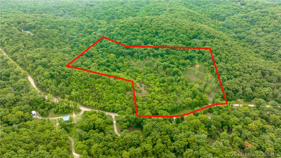 780 Wolf Pen Hollow in Camdenton offers nearly 13 acres of wooded and open land across four lots in Wolf Pen Hollow, creating a peaceful setting for your lake-area getaway, future home, or weekend retreat.

With approximately 388 feet of road frontage, gravel road access, and electricity available, this property gives you the space and flexibility to bring your vision to life.

Enjoy the beauty of a mostly wooded setting with open areas mixed in, along with opportunities for camping, hunting, ATV riding on existing trails, and access to the community boat ramp. Tucked near the Little Niangua Arm and within easy reach of Lake of the Ozarks attractions, this property offers a wonderful blend of privacy, recreation, and convenience.