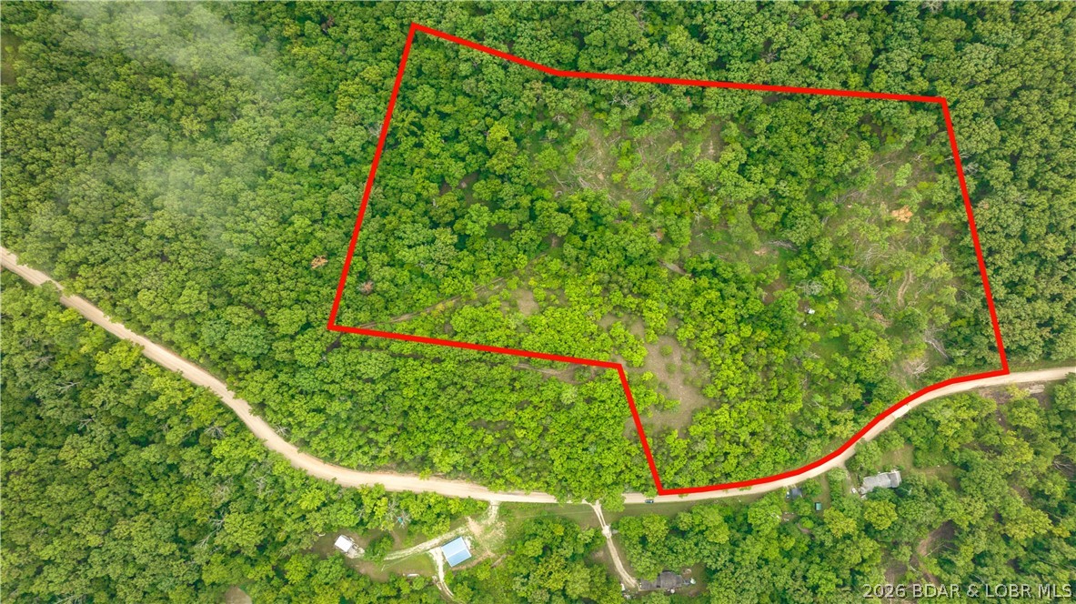 780 Wolf Pen Hollow in Camdenton offers nearly 13 acres of wooded and open land across four lots in Wolf Pen Hollow, creating a peaceful setting for your lake-area getaway, future home, or weekend retreat.

With approximately 388 feet of road frontage, gravel road access, and electricity available, this property gives you the space and flexibility to bring your vision to life.

Enjoy the beauty of a mostly wooded setting with open areas mixed in, along with opportunities for camping, hunting, ATV riding on existing trails, and access to the community boat ramp. Tucked near the Little Niangua Arm and within easy reach of Lake of the Ozarks attractions, this property offers a wonderful blend of privacy, recreation, and convenience.
