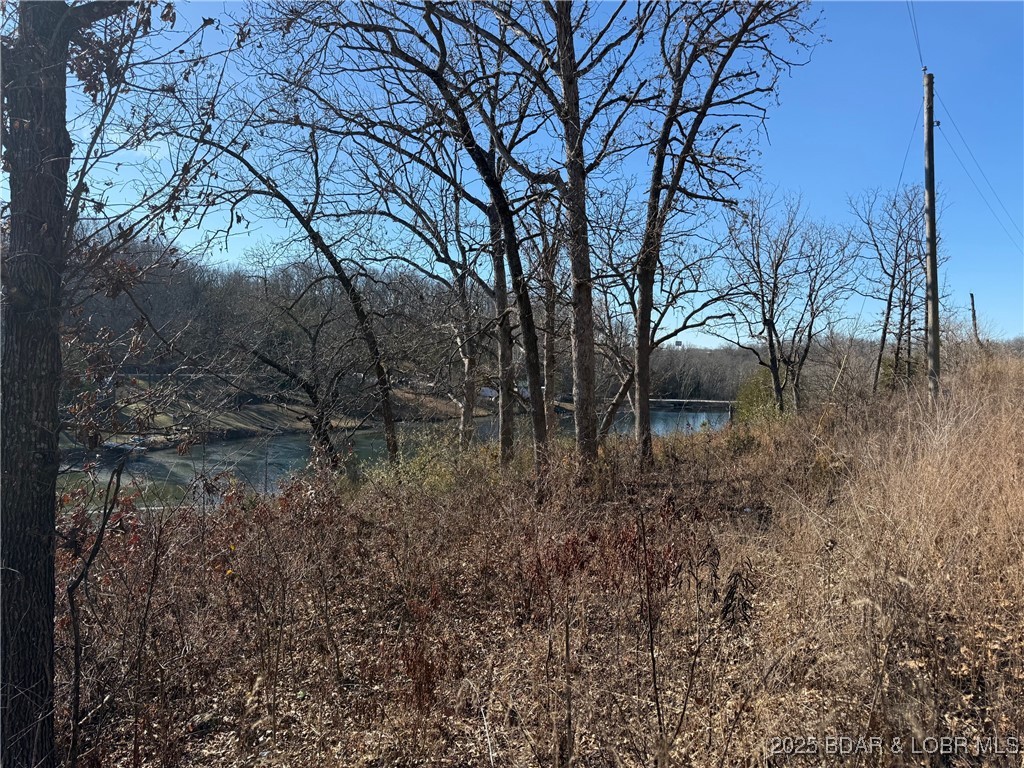 Enjoy the best of lakefront living at an affordable price! This rare double lakefront lot is located on a peaceful interior lake, offering scenic water views and a relaxing setting without the premium price tag. With plenty of space to build your dream home or getaway, this property provides the perfect balance of privacy and convenience. Just minutes from shopping, dining, and everyday amenities, you’ll love having easy access to everything while still enjoying the calm of the lake. Whether you’re looking to build now or invest for the future, this lakefront opportunity is one you won’t want to miss.