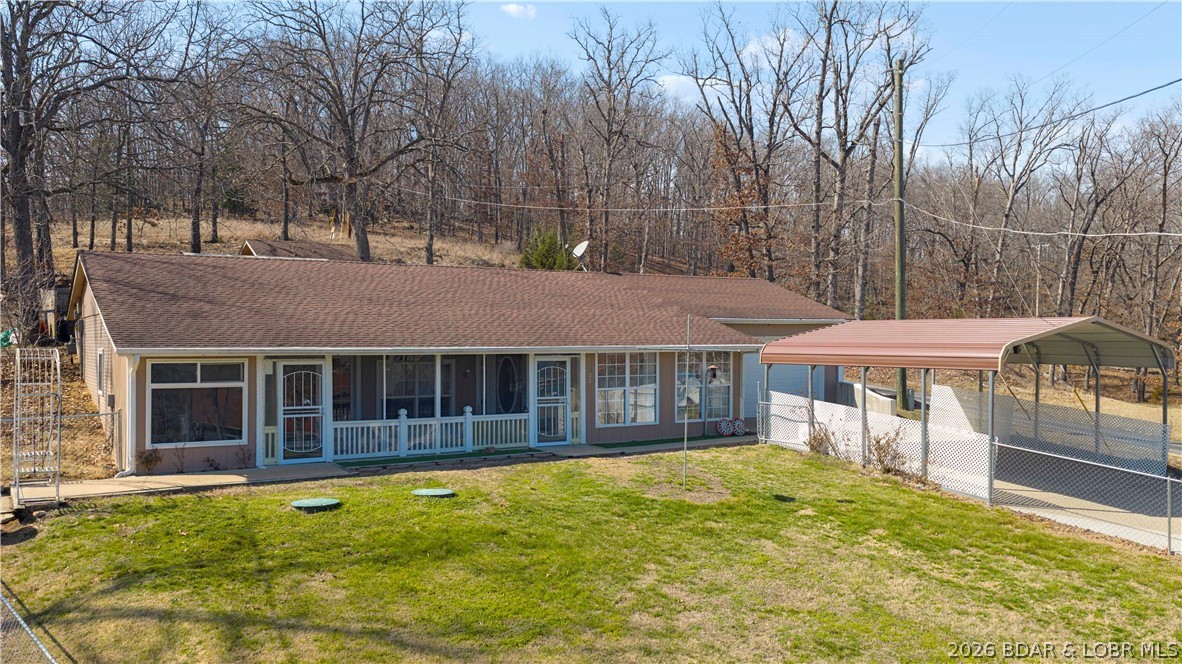 Welcome to your private lake-view retreat at 33268 Greenwood Rd! This unique 3-bedroom, 1-bath earth home offers the perfect blend of comfort, privacy, and natural beauty. Enjoy stunning lake views from the screened-in porch, where you can relax and take in the peaceful surroundings year-round.
Step outside into the screened in porch and unwind in your private hot tub year-round; while enjoying the serenity of the Ozarks. The fenced front yard provides a secure space for pets, gardening, or outdoor entertaining. Built into the landscape, this earth home offers energy efficiency and a cozy atmosphere unlike any other.
Whether you're searching for a full-time residence, weekend getaway, or investment opportunity, this property delivers the quiet, relaxation, and lake lifestyle you've been dreaming of. Don't miss your chance to own this one-of-a-kind retreat in Gravois Mills!