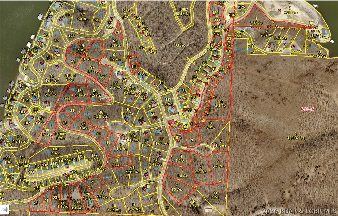 Are You Ready for the Best Off-Water Development Opportunity at the Lake? 53 lots across approximately 50 acres in one of Lake of the Ozarks' premier gated communities — a rare large-scale opportunity at a price point that's nearly impossible to find at the lake right now. Off-water is where the real margin lives at LOTO: waterfront pricing has pushed full-time residents, retirees, and second-home buyers inland, and they're looking for exactly this — gated security, established amenities, and proximity to the water without the waterfront price tag. Build it out, phase it, or develop spec homes — the flexibility is built in. Whether you're a builder hunting inventory, an investor wanting long-term growth, or a developer phasing a full community, the math works.