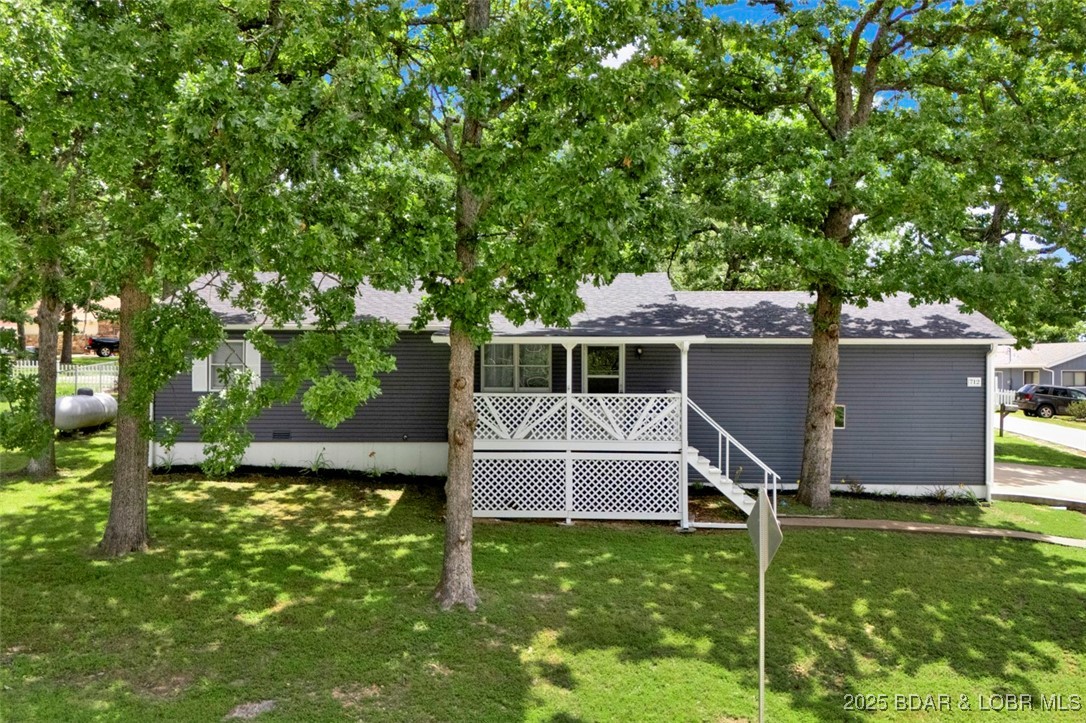 POTENTIAL TO SAVE $-OWNER FINANCING AVAILABLE W/APPROVAL OF CONDITIONS & ACEPTABLE TERMS. Impeccably maintained home w/LOW annual assessments! Offering an exceptional alternative compared to purchasing a 3 bedroom condo! Refined updates to include brand new HVAC (2025), roof (2024) & washer/dryer (2023). This pristine main level living home exudes quality &  care throughout while blending comfort & value! With a crisp clean interior, nice size rooms, tons of curb appeal, privacy fenced area, an attached garage, city sewer & a 10x24 slip in the community dock-it doesn't get any better! A covered inviting porch that allows you to relax and enjoy the lake lifestyle. Outdoor storage shed provides ample space for everything from landscaping tools to all your lake essentials. The remarkably low annual assessments proves this to be a rare smarter long term investment opportunity. A family-orientated neighborhood complete w/a community pool for summer fun & a playground designed for outdoor enjoyment. Blending comfort and value-whether this is a full time, part time residence or as a vacation rental this is ideal package without the high assessments. Start living the lake lifestyle today!