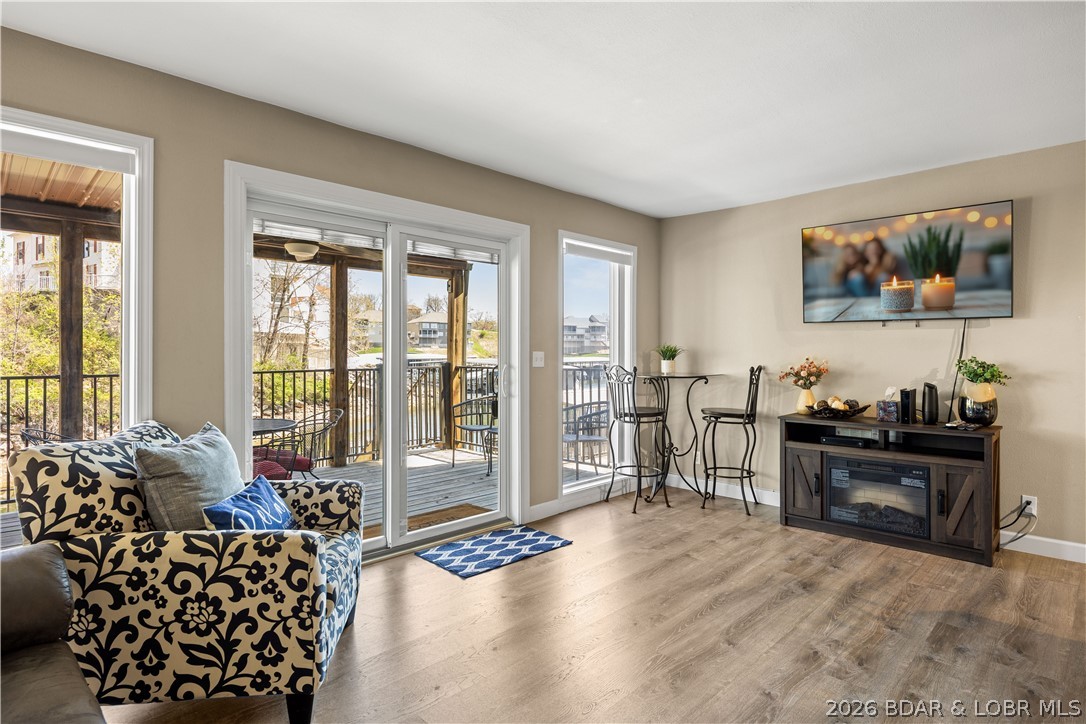 Lakefront luxury meets proven income potential at Southwood Shores in the heart of Four Seasons! This remodeled 1BR/1BA condo at the 12MM is a turnkey nightly rental just steps from the water, offering an ideal Lake of the Ozarks getaway and investment opportunity. Thoughtful updates include luxury vinyl plank flooring, crisp white cabinetry, river stone quartz countertops, stylish lighting, plus a newer furnace, water heater, and washer/dryer. The showstopping bathroom features fresh shiplap a new vanity, modern shower, and updated plumbing and electrical. Fully furnished and ready to enjoy from day one, this condo makes lake life effortless. Southwood Shores delivers amenities including a rare indoor pool and hot tub, outdoor pool, swim dock, playground, tennis courts, clubhouse, boat ramp, and dedicated trailer parking. Minutes from premier dining, shopping, golf, and entertainment, this location keeps you close to everything while giving you a peaceful waterfront escape. Whether you want a personal retreat, weekend basecamp, or income-producing Lake investment, this one checks the boxes. Schedule your showing and make the smarter move to the Lake! See rental revenue projection.