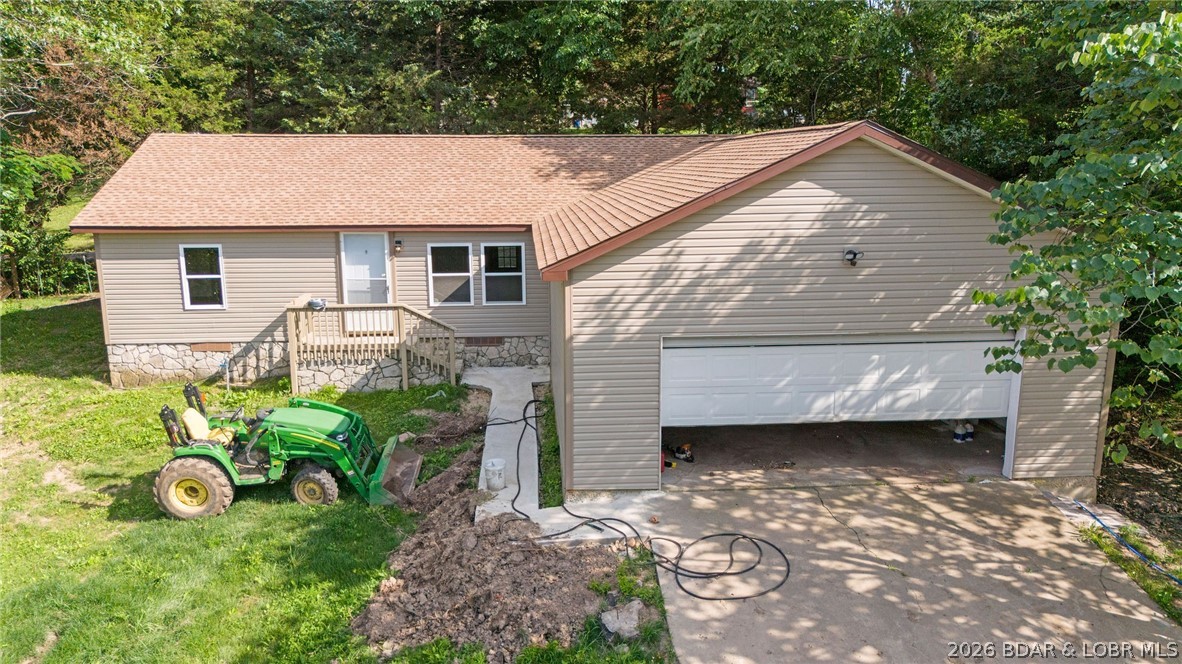 Escape the hustle yet stay close to everything you need in this freshly reconstructed 3-bedroom, 2-bath home located in the highly regarded School of the Osage school district. The home features dramatic vaulted ceilings that create an open, airy feel throughout the living space. Enjoy the convenience of an attached 2-car garage and the peace of a quiet atmosphere, all while being minutes from restaurants, shopping, and everyday amenities. Located just outside city limits, this property offers the perfect blend of affordability, modern updates, and a relaxed lifestyle in the heart of Lake of the Ozarks.