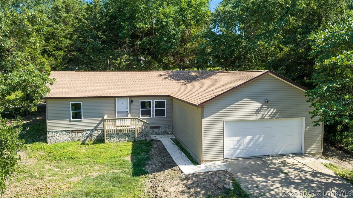 Escape the hustle yet stay close to everything you need in this freshly reconstructed 3-bedroom, 2-bath home located in the highly regarded School of the Osage school district. The home features dramatic vaulted ceilings that create an open, airy feel throughout the living space. Enjoy the convenience of an attached 2-car garage and the peace of a quiet atmosphere, all while being minutes from restaurants, shopping, and everyday amenities. Located just outside city limits, this property offers the perfect blend of affordability, modern updates, and a relaxed lifestyle in the heart of Lake of the Ozarks.