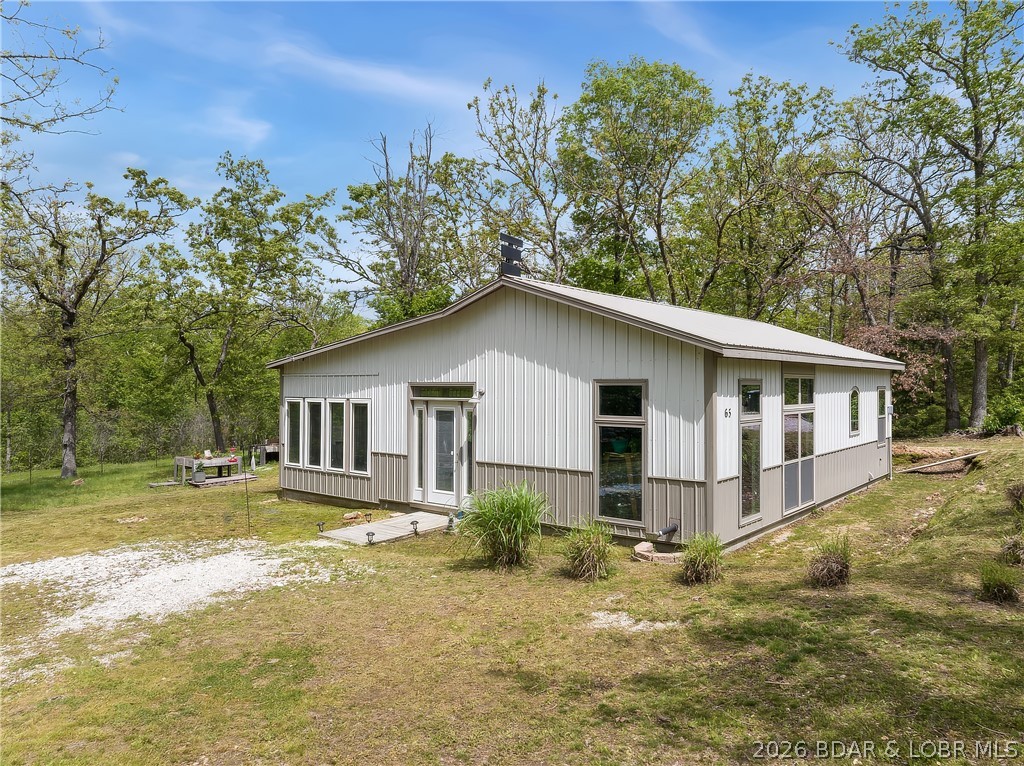 Lake of the Woods Ranch Home on 5 Lots with 1.87 Acres.  This newer Home has low maintenance and lower Utility bills.  One level living and there is an extra room that could be a 2nd Bedroom.  Living Room has Vaulted Ceilings, Pellet Stove and lots of Windows with Concrete Décor’ Flooring.  Open Living/Kitchen/Dining rooms, Stainless Steel Appliances, lots of Shelving & Pantry.  Nice size main Bedroom and the Bathroom has a Walk-In Shower and heated Ceiling Fan.  Lots of room for a Garden and Flower Beds.  There is a 50 Amp Service and 110 Volt for RV Hookup.  Lake of the Woods has a private Fishing Lake for owners to enjoy.