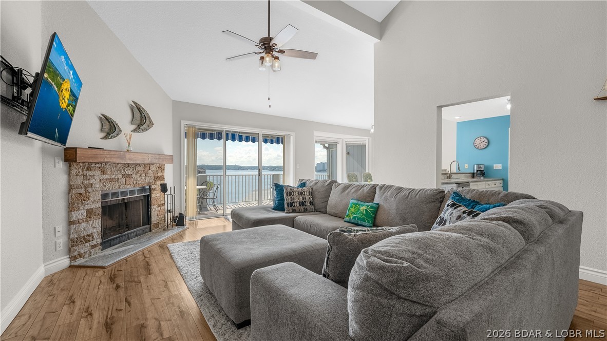 Welcome to this spacious 3 bedroom, 3 bath top-floor condo at Regatta Bay, offering vaulted ceilings and a big main channel view. With a prime location at the 12 MM on Horseshoe Bend, you’ll be close to both fine and casual dining, shopping, golf, entertainment, and some of the best water action at the Lake. This partially furnished condo includes a 12 x 30 boat slip with easy access in front of the condo, a rare find with two storage closets—one on the deck and one outside the front door—and a walk-in laundry room with pantry.  Recent updates include a beautifully tiled master bath shower and vanity top, and LVP flooring. The expansive lakeside deck will be your favorite place for a beverage and watching the boat action. Regatta Bay stands out with acres of green space, plenty of parking, and resort-style amenities including two pools, tennis and pickleball courts, playground, covered picnic pavilion, grilling stations, fire pit, and pet stations.  With 1,600 square feet, this condo is ideal for full-time living, a vacation getaway, or investment use. Call for your private tour today.