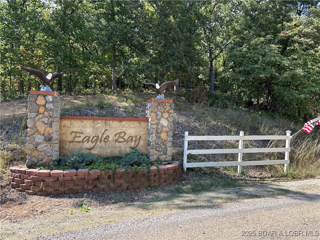 Premier lakefront lot in Phase II of Eagle Bay with stunning views of Proctor Cove and the 55 MM of the Osage Main Channel. This fully developed subdivision features paved roads, central water, central sewer, and electric to each lot—saving you time and money on infrastructure. Build your dream home in a prime location less than 15 minutes from Laurie, near Ozark International Raceway, The Loop Offroad Park, and by water to several popular bars and restaurants. A rare opportunity to own in one of the lake’s most scenic and convenient areas!