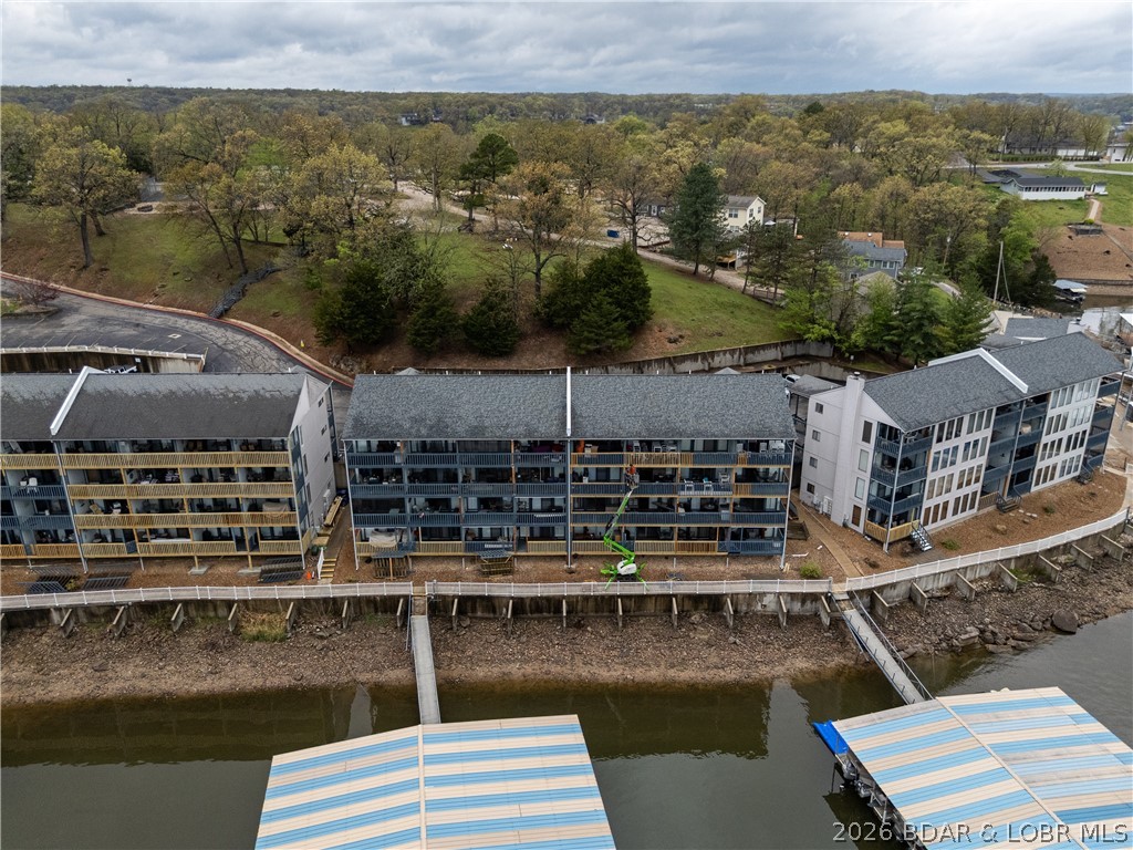 Discover an affordable way to start enjoying life at Lake of the Ozarks! This 1 bed, 1 bath condo is move-in ready and comes complete with stylish finishes and furnishings throughout. This includes luxury vinyl plank flooring, a stacked washer and dryer, and added storage for convenience. Take in beautiful main channel views while still benefiting from the calm, protected cove. The covered deck is the perfect place to relax, whether you're enjoying your morning coffee or unwinding in the evening.
Though cozy in size, this condo is thoughtfully designed to make the most of every space, offering everything you need for the perfect lake retreat. Located in Heron Bay, you’ll enjoy convenient access by both land and water to shopping, dining, and all the popular lake attractions. Whether you're searching for a personal getaway or an income-producing rental, this property offers excellent potential!