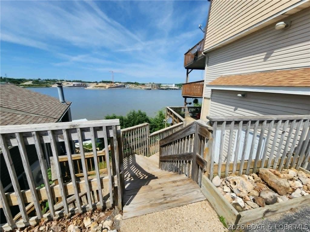 Enjoy lake life at its best with this charming 1 bedroom, 1 bathroom condo featuring breathtaking views of the Lake of the Ozarks. Perfectly located directly across from Top-Sider and the new Oasis at Lakeport, this property puts you right in the heart of one of the lake’s most exciting areas. Relax on the shared lakeside deck while soaking in the scenery or take advantage of the excellent rental opportunity this condo offers. Whether you're looking for a weekend getaway, investment property, or your own slice of lake paradise, this condo checks all the boxes.