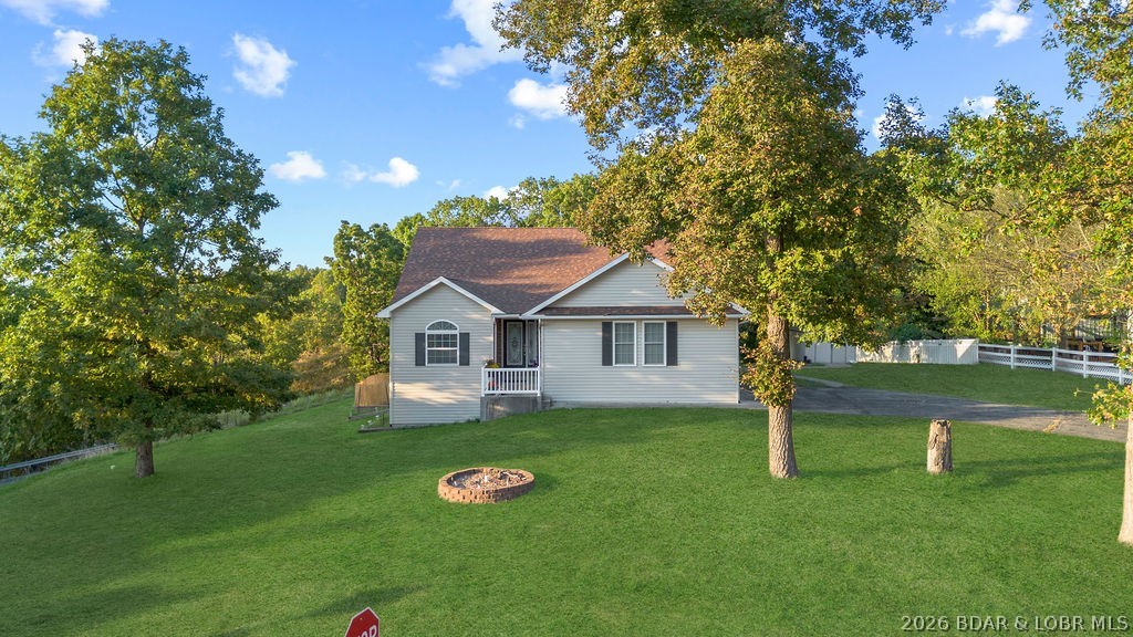 Welcome to this 4-bedroom, 3-bath lake-area-retreat with seasonal lake views that provides convenience, comfort & functionality. With a 2-car garage, full walkout basement, 2 living areas, this property is sure to please your growing family. Step inside to a warm layout where the main level offers open living & dining spaces, perfect for gathering around the table. The kitchen is well-planned with plenty of storage & counter space for everyday cooking or preparing holiday meals. The primary suite offers an ensuite with walk in closet, while the additional bedrooms provide flexibility for children, or a home office. A highlight of the home is the four-seasons room ideal for relaxing year-round. Just off the main living area, you’ll find an open deck, great for grilling & enjoying fresh air. The lower-level walkout basement provides incredible versatility, whether you envision a second family room, play area, or home theater, with direct access to the patio. This near 1 acre lot has unlimited potential. Imagine an ADU rental income, a mother-in-law suite, workshops, or boat storage. All of this in a great school district within city limits. Don't wait to see this one. Schedule today.