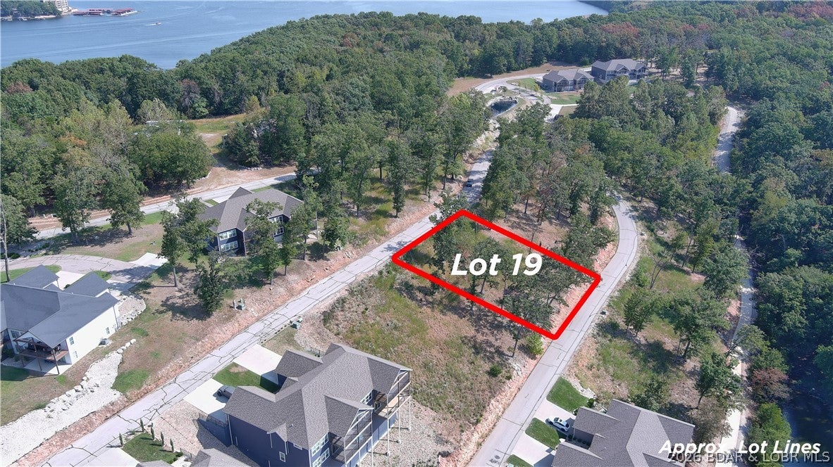 Amazing opportunity to purchase a lot with a water view in a well established subdivision. This lot will allow you to build a private home or a Villa in the Villas of Tuscany Subdivision. This location is one of the most ideal lots within the subdivision. Amenities are already in place with water & sewer, internet access through Spectrum. You will enjoy the amazing pickle ball court, community pool & bath house, and golf cart path down to the community docks. Community dock slip is available for additional purchase. Note- proposed structure shall be approved by Architecture Review Committee and landscaping will also need to be approved. (Subdivision will maintain landscaping of home, just as a Villa). Buyer to verify hook-up fees to water & sewer. Great opportunity to build your dream home that allows for some maintenance free lake enjoyment or a Villa for yourself or for investment. Wonderful location by land and water.