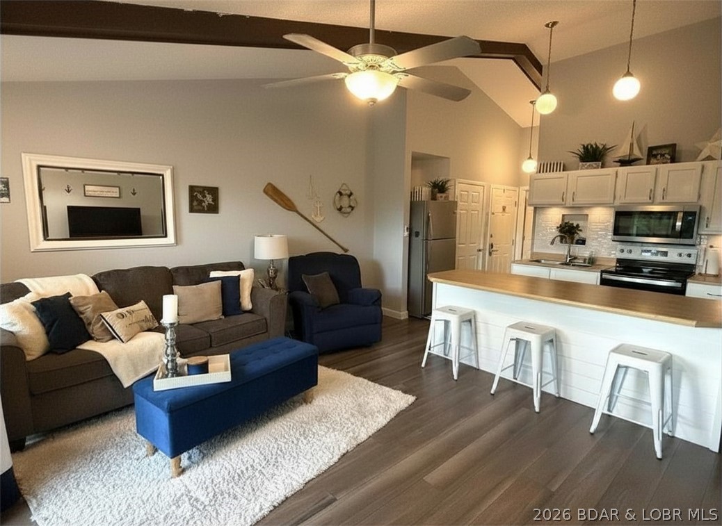 Top-floor, fully remodeled showstopper 1-bedroom condo that feels like a true lake retreat the moment you walk in. Soaring vaulted ceilings and an open, airy layout set the tone, paired with all-new flooring, updated kitchen, fresh paint, modern lighting, and brand-new decks. Completely move-in ready and designed for easy lake living or strong rental income.Step outside and enjoy your private space, then dive into resort-style HOA amenities: newly remodeled heated indoor pool and hot tub, lakefront pool, swim dock, boat ramp, trailer parking, playground, and pickleball courts.Perfect as a weekend escape, full-time getaway, or investment property. Just minutes from dining, shopping, golf, and all the best of Lake of the Ozarks. This one stands out—don’t miss it.Enjoy easy lake living with everything already done for you—no updates, no projects, just show up and start enjoying. Whether you’re sipping coffee on the deck, hosting friends for a lake weekend, or maximizing short-term rental potential, this unit delivers flexibility, comfort, and that sought-after Lake of the Ozarks lifestyle.