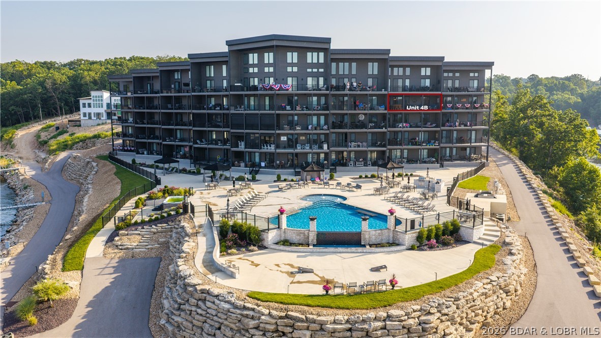 Luxury and comfort right on the lake at The Havens at Village of Four Seasons. ADA compliant building is constructed with high-quality materials like a steel roof, Hardie Plank Siding and Anderson windows and doors means no special assessments for deferred maintenance lurking around the corner. Enjoy luxury with confidence!  It would be tough to beat the panoramic lake view and Four Seasons fireworks from the spacious screened in deck, it's outfitted with American Sun Control Power sun shades. Enjoy top-tier comfort featuring high-end appliances and upgraded light fixtures and a Sleep Number mattress in every bedroom. Truly a resort feel at The Havens, with walking trails, a lakeside fire pit, clubhouse and fitness center and an incredible resort style pool with cabanas and an outdoor kitchen. Take the elevator with your cooler, kids or kayak down to the dock level where you'll find your 14x 40 slip with 8800# lift. The complex features trailer parking and a boat ramp and ample parking.  This ready for you condo also comes with a highly coveted garage. Call your Real Estate Professional today!