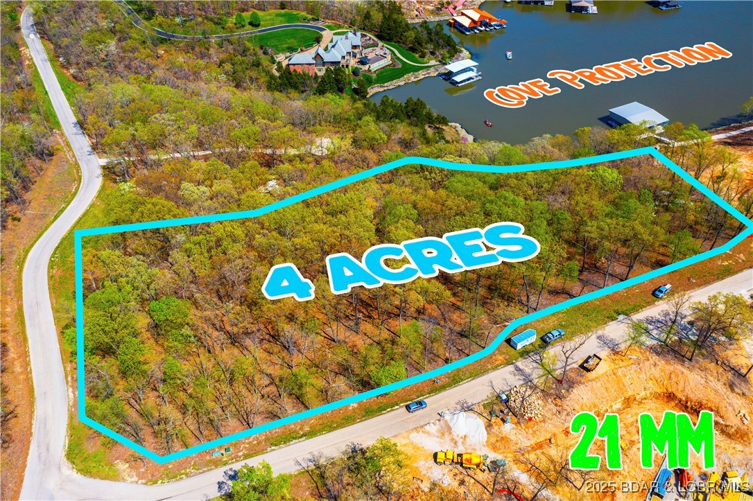 This is one of the last Estate properties left in The Villages! If you’ve been looking for the perfect place to build your own
personal paradise, this could truly be the place that would make your dreams come true. Come check out this
beautiful estate property in one of the most exclusive developments, The Villages of Shawnee Bend. This great
lot located on MM 21 consists of 4.12 acres and over 300 ft of pristine lakefront shoreline. You will enjoy your
privacy while being located in a cove, but still be just minutes from some of the Lake's finest amenities. This lot
features access to community water and sewer, excellent views of the main channel, and in a neighborhood of
other exclusive estate size properties and homes. Owner had plans to build on this lot, so underbrush and pad site has been cleared. Make your appointment to see it today!