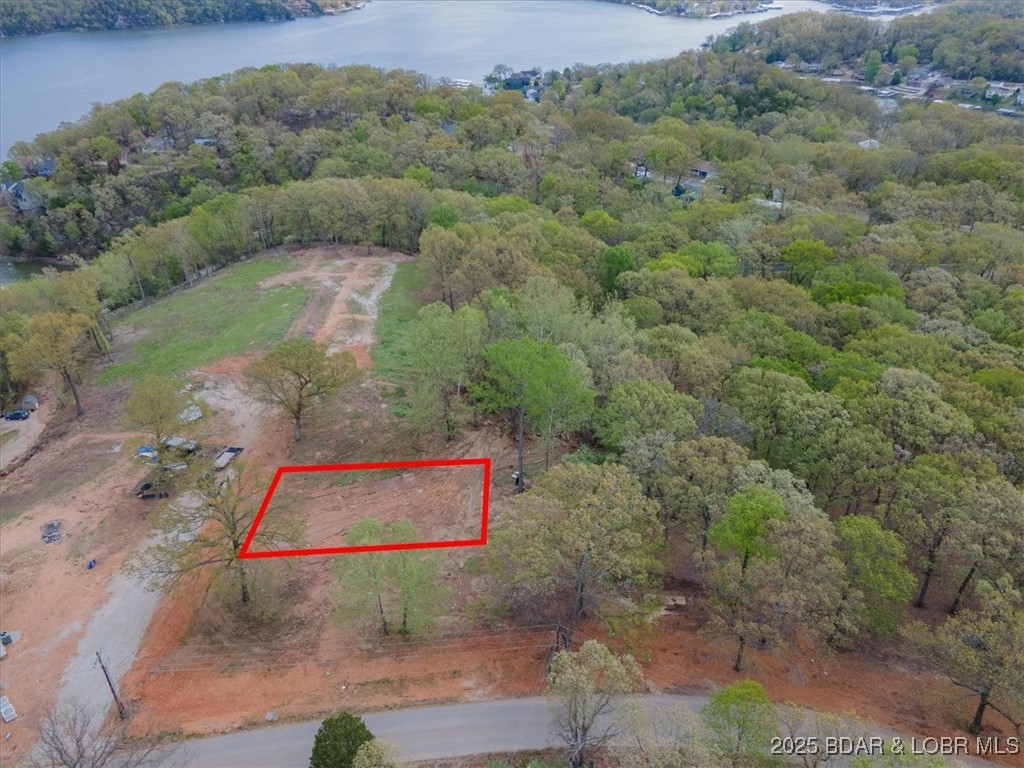 Discover the perfect blend of tranquility and convenience in Osage Heritage subdivision, ideally situated between Camdenton and Osage Beach. This 0.31-acre gentle lot offers a serene setting for your dream home, with easy access to all amenities and attractions these vibrant communities have to offer.