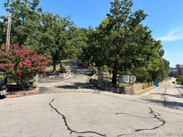 3BR/2 bath condo located at the 2 MM of Lake of the Ozarks.  Amazing view to watch the boats from your covered patio.  Storage closet located on the patio.  Interior palette gives a tropical feel to this 1st floor condo.  Most furniture and all appliances will remain with the property.  Includes nearby 12x28 covered boat slip in community dock.  Boat lift is available for extra $$$.  1200 SQFT and open floor plan make this condo very comfortable to live in.