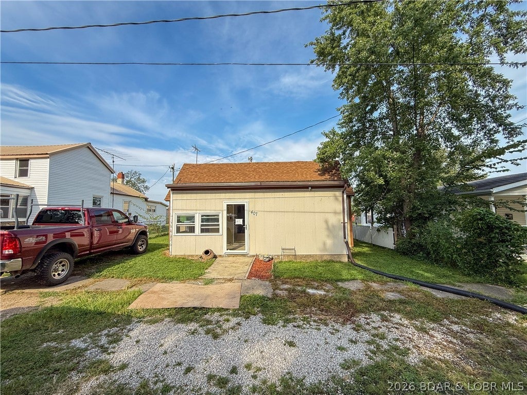 Looking for a property with great garage and storage space? This 1 bed, 1 bath home sits on a large lot and offers plenty of room both inside and out. The home features a spacious kitchen, a large bedroom, and plenty of storage throughout. A small front porch offers additional potential and could be finished to create an inviting outdoor space. The standout feature is the  24x27 detached garage, complete with two bays, 12 foot walls, concrete floor, electric, 10 foot manual garage doors, and a loft for additional storage. Whether you need space for vehicles, tools, hobbies, or a workshop, this garage provides plenty of possibilities. The seller is also leaving a new hot water heater, trim, and several other materials to help the next owner continue finishing and improving the home. City utilities and high-speed internet are available, adding everyday convenience. With a large lot, useful garage space, and the opportunity to add your own finishing touches, this property could make a great full-time residence, investment property, or affordable option for someone wanting extra workshop and storage space.