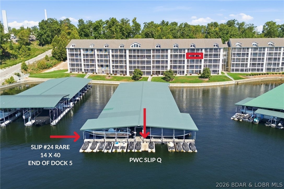 LAKEFRONT GEM WITH A RARE END-OF-DOCK SLIP! This furnished, turnkey 3BR/2BA Millstone condo offers an exceptional lake lifestyle with a highly desirable 14' x 40' dock slip on Dock #5, ideally positioned at the very end for uninterrupted water views—a truly valuable and hard-to-find feature! From the turnkey condo and spacious, fun-filled furnished deck, take in stunning direct main-channel views while relaxing in style. This 3 Bedroom 2 Bathroom condo sleeps 9 and features a private primary ensuite, neutral décor, beautiful stained cabinetry, pantry, and convenient elevator access. Enjoy the well-managed complex’s pool, fitness center, and reasonable assessments. Opportunities like this don’t last—schedule your private showing today!