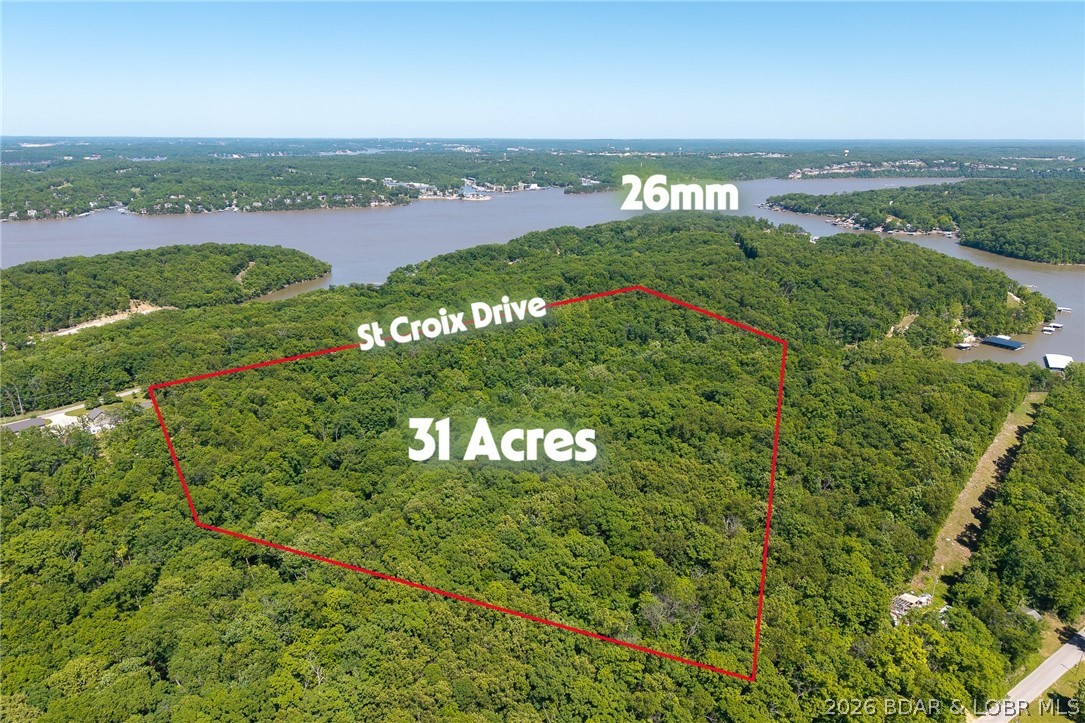 Exceptional development and investment opportunity in the heart of Sunrise Beach! This 31± acre offering consists of four parcels ideally located off St. Croix Rd with excellent accessibility and strong future potential. Several areas of the property offer seasonal lake views, while the lower portion sits just minutes from Pappa Chubbys, adding to the appeal for future residential or mixed-use possibilities. The upper portion fronting St. Croix Rd presents an excellent setting for development with convenient access and attractive topography. Additional acreage located directly across the street is also available, creating the potential for approximately 60± contiguous acres. With development activity at Lake of the Ozarks continuing at record levels, large tracts like this are becoming increasingly difficult to find. Conveniently located near Hwy 5 and Woods Supermarket grocery store and gas station, this property offers a rare combination of location, versatility, and long-term investment potential.