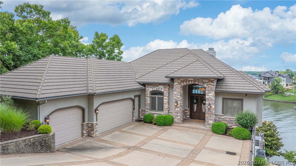Experience the ultimate lakefront lifestyle in this breathtaking 6,000 sq ft luxury retreat! Fully furnished with newer, high-end furnishings, this exquisite home seamlessly blends comfort, elegance, and practicality. With 6 bedrooms and 5.5 bathrooms, there’s ample space for family & guests to relax in style. The main level offers an open-concept layout, featuring a custom gourmet kitchen, spacious living areas, & easy access to a screened-in patio—perfect for unwinding. The expansive master suite includes a luxurious en-suite bathroom and a generous walk-in closet. The lower level boasts 4 additional bedrooms, 3 full bathrooms, a second living area, and a wet bar—ideal for entertaining. A walk-out basement reveals a third living space, a 6th bedroom with
private bath, and direct access to the private pool and hot tub. Enjoy stunning main channel views with the benefit of cove protection from your impressive 2-well dock, which includes a 16x44 slip, a 12x30 slip, 4 covered PWC slips, & a spacious swim platform. A 3-car garage completes this entertainer’s dream. A complete package option is avail which includes the boat & cover, lift, PWC's, PWC Pads, for add. $$.
