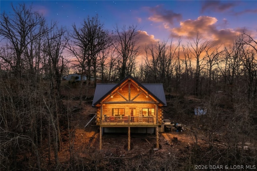 New construction with character you simply can’t fake—this Amish-built log cabin delivers warmth, craftsmanship, and a view that steals the show. Designed to feel like the perfect lake escape, the home offers 2 sleeping areas with 1 main-level bedroom plus a spacious 15x24 loft, along with a full bathroom and soaring vaulted ceilings that make the interior feel open and inviting. Natural wood finishes and authentic log construction give it that true cabin feel buyers are looking for. Step outside to the huge covered deck where the outstanding lake view becomes the backdrop for morning coffee, evening dinners, and everything in between. Whether you're looking for a weekend getaway, investment opportunity, or low-maintenance full-time retreat, this property offers that hard-to-find blend of new construction and rustic charm. Lake access is easy with a nearby boat ramp, making days on the water simple and convenient. If you’ve been looking for a place with personality, craftsmanship, and a view worth showing off—this one stands out.