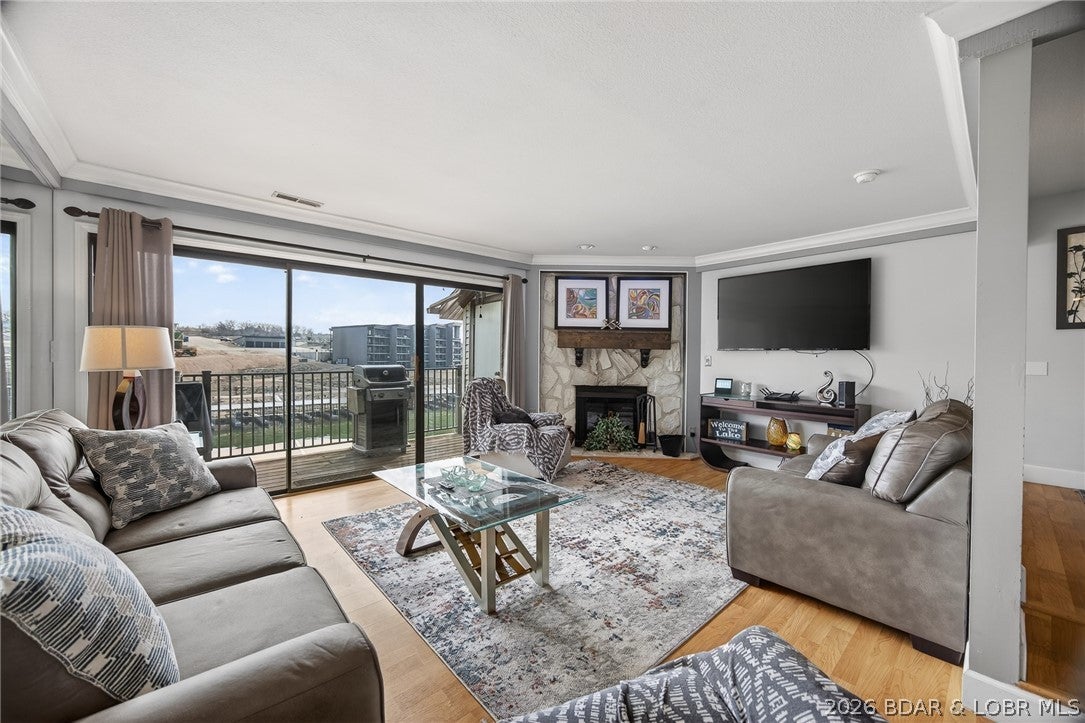 MOTIVATED SELLER! Top-floor views and lake life at its best. This 2 bedroom, 2 bath condo in a highly sought after complex is all about easy living and effortless entertaining. Wall-to-wall lakeside sliders keep those breathtaking views front and center all day long and also provide an abundance of natural light. The open layout flows perfectly, featuring a kitchen with breakfast bar and dining area, while the cozy fireplace adds warmth and charm to the living space. Partially furnished. The large lakeside deck is perfect for morning coffee or evening BBQs. 10x24 slip is included, just bring your boat and start enjoying the lake life. Enjoy numerous on-site amenities including a pool, clubhouse, management, security, playground, boat ramps, tennis/pickleball courts, fitness area, waterfront walking/golf cart path, firepit area, and multiple scenic, waterfront viewing areas. Conveniently located by both land and water, this is more than just a complex, it’s a true lakefront community.