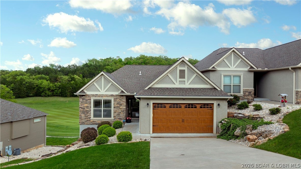 Exquisite turnkey 4-bedroom, 3-bath villa on the 12th fairway of the acclaimed Tom Weiskopf golf course at Old Kinderhook. Soaring ceilings, wood floors, and an open-concept main living space centered on a cozy fireplace welcome you home. The kitchen features quartz countertops, stainless steel appliances, seating for six at the counter, and a formal dining table for six, ideal for entertaining. Step onto the covered upper balcony to take in fairway views with morning coffee or evening wine.
Downstairs, a second living area with a poker table and space for board games makes an entertainment hub for gathering and relaxing, opening to a private lower balcony perfect for sunbathing or stargazing. This home comfortably sleeps 12 across its 4 bedrooms, a rare layout for a gated golf villa.
Enjoy resort-style living within the gates of Old Kinderhook, including championship golf, pools, tennis courts, a spa, fitness centers, dining, lake access, and a seasonal ice rink. Meticulously maintained with a rare combination of livability and location in the heart of Missouri's lake country. Don't miss this one.