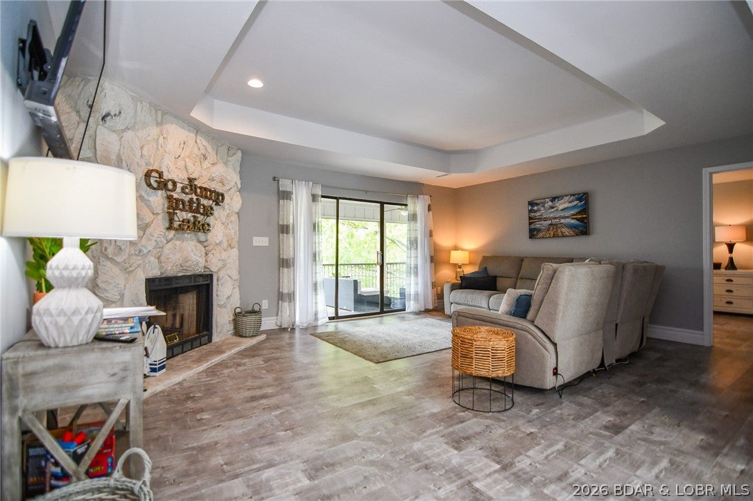 Beautifully remodeled top floor 3 bedroom 2 bathroom move-in ready condo! Offered at a great price! Currently on a successful rental program! Fully furnished, modern fixtures and appliances, and tasteful decor make this condo your perfect lake escape or investment property. Spacious screened in deck with lake view accessible from the living room and 2 bedrooms. Primary bedroom is an en suite and has a full sized bathroom with oversized vanity.  The Osage Vistas condo complex sits on 23 acres of landscaped grounds and offers an abundance of amenities. Osage Vistas resort-like amenities include 6 pools (1 nearby), walking paths, playground, marina with boat ramp and more! Access to Four Seasons amenities are included, too! Four Seasons offers a new indoor pool, multiple outdoor pools, campground, parks, sports courts, and more! Visit https://www.osagevistas.com/home and https://fourseasonspoa.com/amenities/ for more information about the Osage Vistas, Four Seasons, and amenities offered. *Seller to pay for 2 quarters of POA dues upon successful closing*