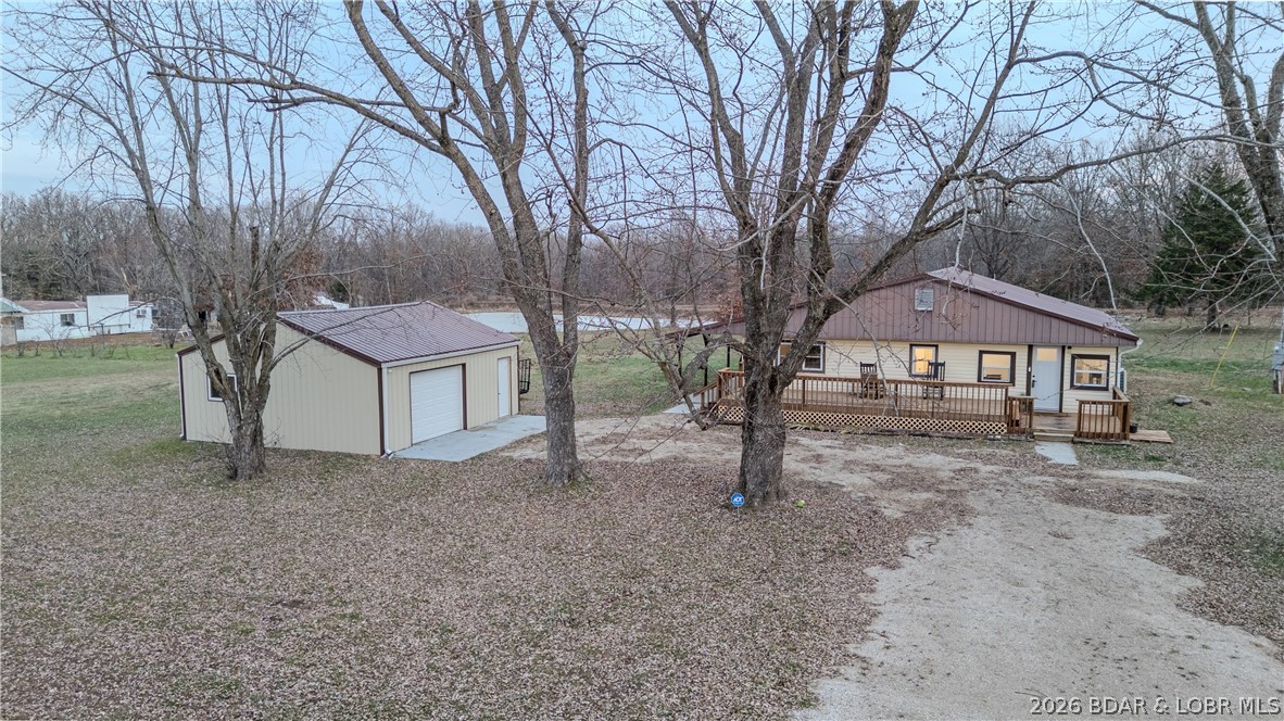 Discover country living in this beautifully updated 4-Bedroom, 2-Bath home offering 1,600 Sq Ft of living space on nearly 3 acres! Recently remodeled, this home features new LVP flooring throughout, carpet in the bedrooms, newer appliances, and updated bathrooms! Each room is equipped with it's own mini-split for comfort and convenience. As an added bonus, the septic tank was just upgraded in 2025 as well! Outside, you'll find a detached garage in the front plus an additional outbuilding in the back, perfect for additional storage, hobby space, or finish it out into an ADU living space! Just minutes to Stover and a short drive to Lake of the Ozarks! Move-in ready with room to roam-this property offers the ideal blend of convenience, space and modern updates with NO restrictions or building requirements, your opportunities here are endless! Schedule your showing today! Original structure is a Manufactured Home that has been added onto. It's all under one roof and has been resided. The Manufactured Home is not affixed therefore it will not qualify for Government Financing.