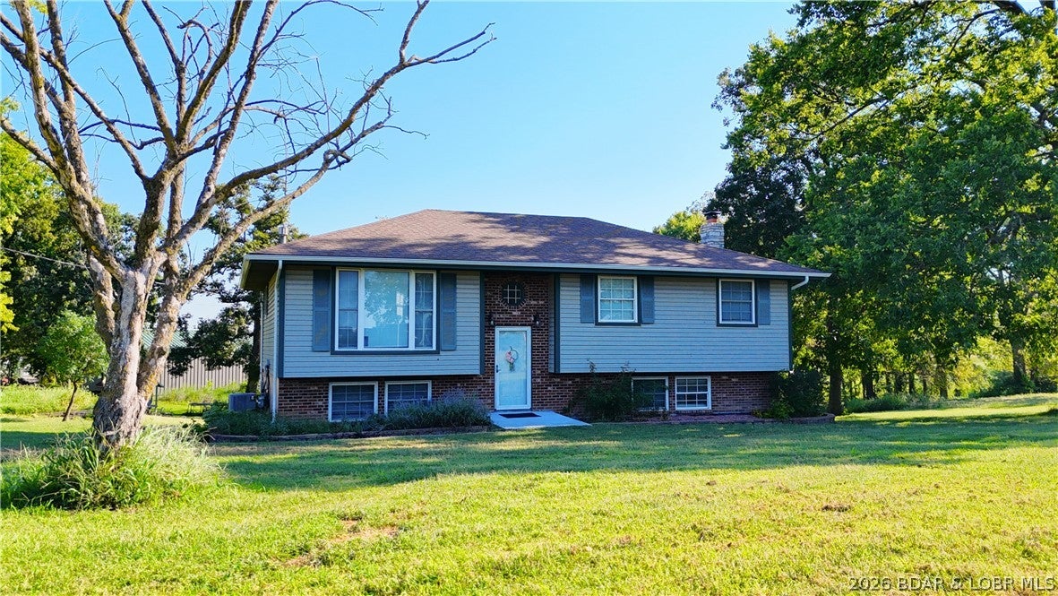 Charming Country Retreat in High Point

Welcome to peaceful, small-community living in High Point—offering the perfect blend of quiet country charm and convenience with all-paved access (no gravel roads). Located just 10 minutes from Eldon and Versailles, and a quick 30-minute commute to Jefferson City.

Home Features:

Spacious Split-Level Layout: Offers 3 main bedrooms and 2 full bathrooms.

Finished Lower Level: Features a cozy family room complete with a wood-burning stove, plus an additional non-conforming bedroom ideal for guests, an office, or extra storage.

Outdoor & Property Highlights:

Acreage & Yard: Set on 2.4 lovely acres featuring a circle drive, garden space, and a playhouse.

Outbuildings & Pasture: Includes a 2-car detached garage/workshop alongside a barn with a small pasture—perfect for animals, hobbies, or extra storage.