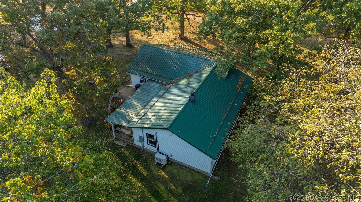 Move-in ready country home on 19.38 acres in Hickory County, Missouri! This updated 3 bedroom, 2 bath home features major improvements including new windows, new roof, updated wiring, and a new septic system, giving buyers peace of mind and modern comfort.
The property offers a great mix of fenced pasture and wooded acreage, perfect for livestock, recreation, and wildlife. A beautiful spring-fed pond stocked with fish adds to the charm and provides a great place to relax or enjoy fishing.

Outbuildings include a 2-car detached garage with workbench and storage area, a large pole barn for equipment and hay storage, plus a well house with an additional storage shed.

This property is ideal for a hobby farm or anyone wanting to enjoy country living at its best with plenty of room for animals, equipment, and outdoor activities.