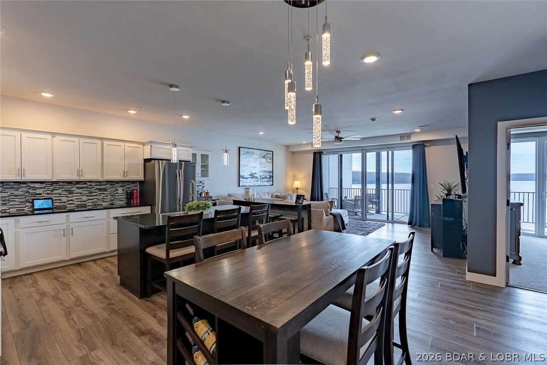 This unit is a true showstopper—defined by class, luxury, and refined design. This walk-in residence features an open floor plan with high-end finishes. From the moment you step inside you’re greeted by breathtaking lake views with miles of unobstructed scenery overlooking the State Park. Located in the heart of Osage Beach, this newer complex offers convenient access to top amenities by both land and water. Elevator access and a protective wave break add to the ease and security of ownership, while the 16x40 boat slip is perfectly positioned for lake enjoyment. Offering approximately 1,600 square feet, the unit includes two guest bedrooms and a full bath, along with a lakeside primary suite featuring a spacious bath with double vanity, tiled walk-in shower, and large walk-in closet. The kitchen is thoughtfully designed with granite countertops, ample cabinetry, pantry, SS appliances, and a wine cooler with bar area—ideal for entertaining. The great room opens directly to a large covered concrete deck with a storage closet, providing an exceptional outdoor living space that can easily be screened. An oversized laundry room with additional storage completes this impressive offering.