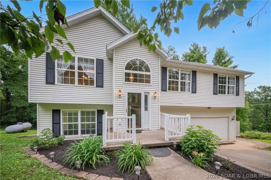 Nestled on 2.5 beautifully wooded acres in Linn Creek, this 2,500 sq. ft. retreat offers the ultimate balance of privacy and proximity. Imagine quiet mornings on your back deck, soaking in the peace of a secluded lot where the only neighbors you’ll hear are the local wildlife—all while being just minutes from Camdenton’s best restaurants, shopping, and Lake of the Ozarks fun.
The home features a classic layout with formal living and dining rooms, plus a smart bedroom configuration: three spacious rooms on the upper level and a private fourth bedroom on the lower level, perfect for guests or a quiet home office. With a 2-car garage and plenty of open area to roam, this is the serene family sanctuary you’ve been waiting for.
Seclusion, space, and a location that can't be beat!