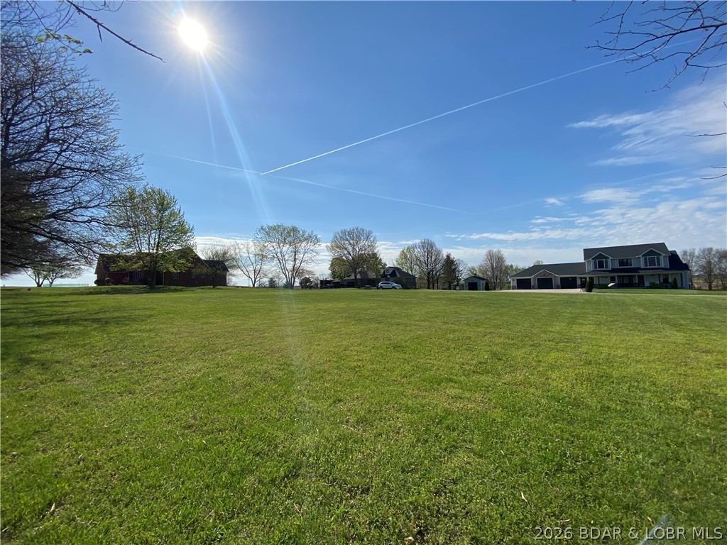 Build your dream home on this beautiful 0.75-acre lot located in a desirable subdivision and backing directly to the golf course. Enjoy peaceful views, a scenic backdrop, and the feeling of extra space behind your property. This lot offers a great opportunity to create the home and outdoor living area you have always wanted while being nestled in an established neighborhood. Maybe you've been thinking it's time to retire or move off the Lake but you don't want to go too far, this could be your answer. The location combines community living with the beauty of the course right in your backyard. A rare chance to own a homesite with golf course views and plenty of room to bring your vision to life.