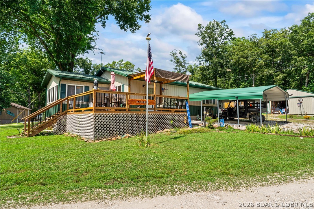 TWO HOMES & A LAKEFRONT LOT – Unique Investment Opportunity at the 61 MM! Don’t miss this rare chance to own two lake homes and a lakefront lot with dock—all for one price! Located on the main channel at the 61-mile marker, this property offers spectacular lake views, excellent rental potential, and endless outdoor enjoyment. Each home includes 2 bedrooms and 1 bathroom, with modern finishes, cozy living spaces, and expansive decks overlooking the water. One home features a sunroom—perfect for enjoying lake views year-round in total comfort. Live in one, rent the other on VRBO, or host guests in their own private space—the possibilities are wide open! Property highlights: Private dock with a 10x24 boat slip Sunroom with stunning lake views 1 plus car garage Storage shed Gazebo for outdoor lounging and entertaining This is a truly unique opportunity to invest in two turnkey lake homes on a prime waterfront lot. Whether you’re looking for a weekend getaway, full-time living, or income-producing property, this one checks all the boxes!