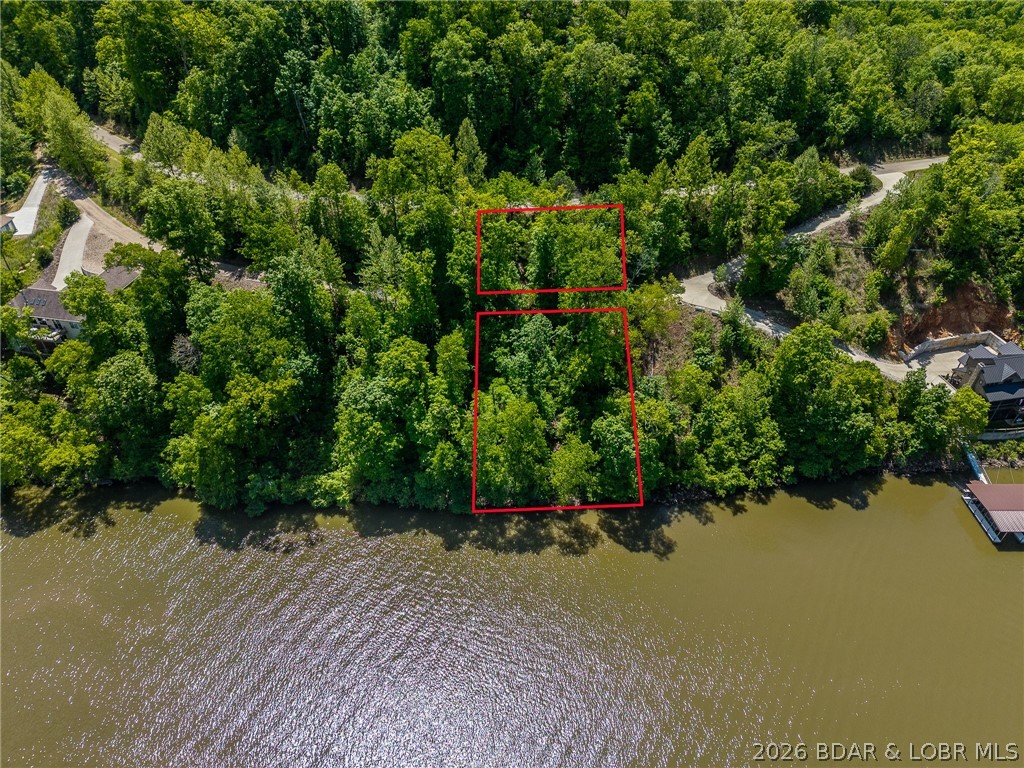 Lake of the Ozarks, lake front lot ready for you to build that dream lake house! Fantastic views at the 55 mile marker of the Osage. Community water, central sewer and electric access! Pavement the whole way! Bring your plans and make those dreams a reality!