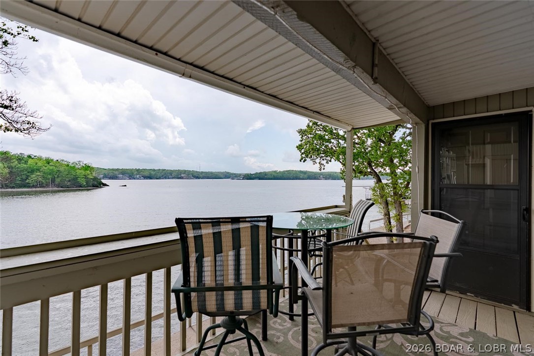 Imagine waking up to miles of sparkling lake views stretching down the channel—coffee in hand, watching the water come to life for the day. That’s everyday life in this 2 bed, 2 bath condo at Pelican Bay. Perfectly positioned for a truly incredible view, this unit offers a front-row seat you won’t find just anywhere. Inside, you’ll appreciate the updates already done for you, including newer flooring, paint, HVAC, washer/dryer, and toilets. It comes partially furnished, making it easy to start enjoying immediately yet ability to add your personal touch. Step out onto the deck and you’ll find one of the most unique features—your own private set of steps leading directly to the lakefront boardwalk and straight to your 12x28 boat slip with hoist. Convenience like this is hard to come by. HOA dues here have remained steady and affordable, a major advantage in today’s market. Don't miss the awesome pool, hot tub and HUGE updated clubhouse w/kitchen, baths, party room, and outdoor grilling station! Located right across from Margaritaville Lake Resort and just minutes to Paradise Tropical Restaurant, Papa Chubby's, and Miller's Landing. Opportunities like this, at this price, don’t last.