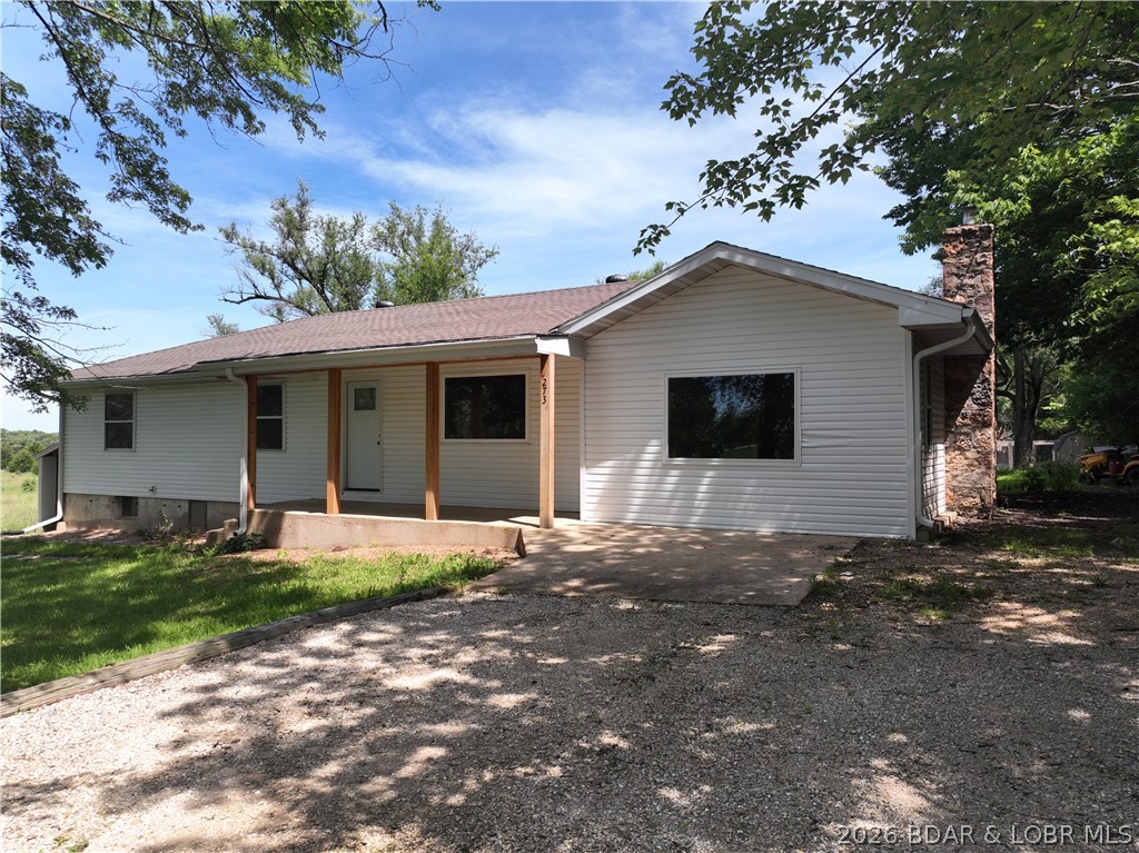 Welcome home to this charming farmhouse-inspired retreat situated on a spacious half-acre lot just off Highway 5 in Camdenton! This 3-bedroom, 2-bath home offers the perfect blend of comfort and country charm. Step inside and enjoy the warm, inviting atmosphere highlighted by a cozy wood-burning fireplace, ideal for relaxing evenings at home. The farmhouse feel carries throughout the property, creating a welcoming space that's both stylish and functional. Conveniently located with easy access to town, schools, shopping, and the Lake area, this property offers the best of country living with modern convenience. Don't miss your opportunity to make this charming home your own!