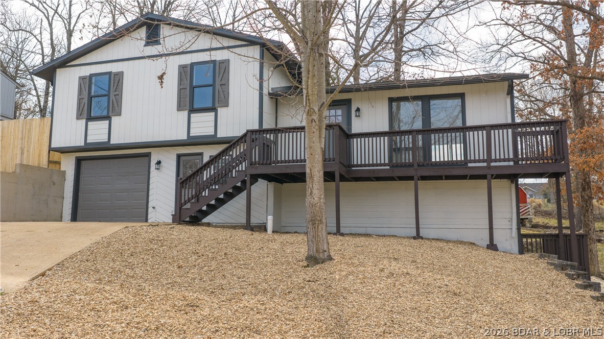 Nestled in a serene and charming neighborhood just minutes from Camdenton Square, this updated 5-bedroom,
3-bathroom home is a hidden gem ready for its new family. Ideally located near the area’s best shopping,
dining, and entertainment, the home offers both comfort and convenience. Recent updates include all-new
kitchen appliances, new carpet, LVP flooring, freshly remodeled bathrooms, and fresh paint throughout. The
main level features a beautifully remodeled kitchen that opens to a cozy dining area, while the spacious living
room provides a warm and welcoming atmosphere perfect for relaxing or entertaining. Upstairs, you’ll find a
private master suite, two comfortable guest bedrooms, and a stylish full bathroom. The lower level offers two
additional bedrooms, a half bath, Laundry Room, an extra living area, a one-car garage, and direct access to the
backyard—ideal for kids, pets, or simply enjoying the outdoors. Whether you’re searching for a cozy full-time
residence or a promising investment opportunity, this home is one you won’t want to miss.