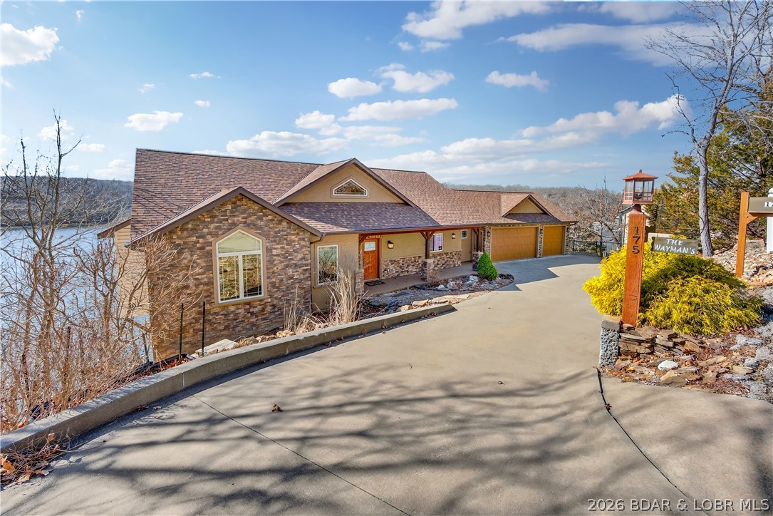 Offered by its original owners, this lovingly maintained 5-bed, 6-bath lakefront home on Linn Creek Cove was built to bring people together. Soaring ceilings, rich wood accents, and open light-filled spaces flow naturally to the outdoors, where deep year-round water and a concrete dock set the stage for memories. The dock features two 12x30 slips, a 12x22 swim platform, and a 4x8 storage locker ,everything needed for a summer of boating, swimming, and lakeside gatherings. A three-car garage handles all the gear, and the large unfinished space below is ready for a guest suite, game room, theater, or fitness space. Cross Creek offers pool and clubhouse access, STR potential, and a 1031 exchange opportunity. Pre-listing inspected with a one-year home warranty included. Built with intention. Ready for your family's next chapter.